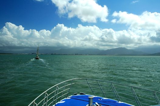 sailing on a boat to Cairns, green ocean, sailboat