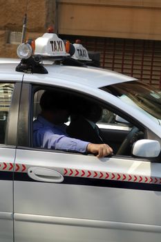 taxi drvier and passager in taxi, open window, sydney