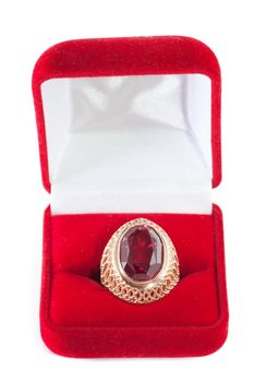 Gift box and ring with red gem inside isolated over white