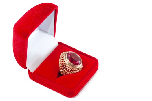 Gift box and ring with red gem inside isolated over white