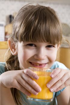 little cute adorable  girl seven years old drink orange juice