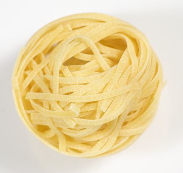 italian pasta tagliatelle on white background