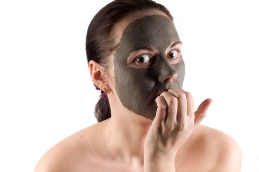 Woman having a mud mask in spa