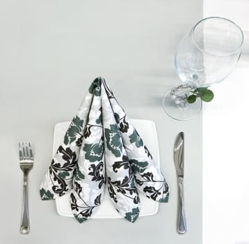 Napkin, glass and silverware on a table
