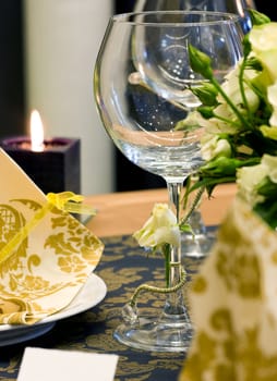 Wedding table decorated with bouquet and candle