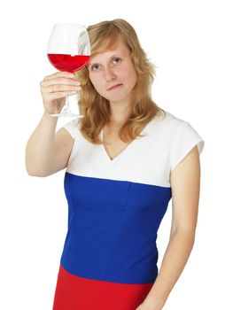 A girl looks at a glass of red wine isolated on white background