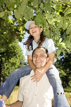 The daddy and the daughter have fun and play oak wood