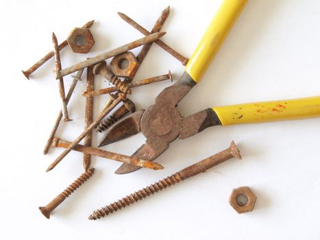Rusty tools, screws, nails, nuts and bolts.