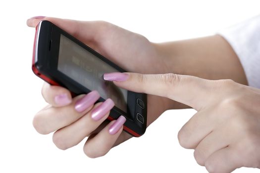 The female hand holds a mobile phone
