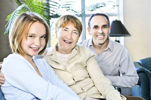 Happy family of three generations sitting together