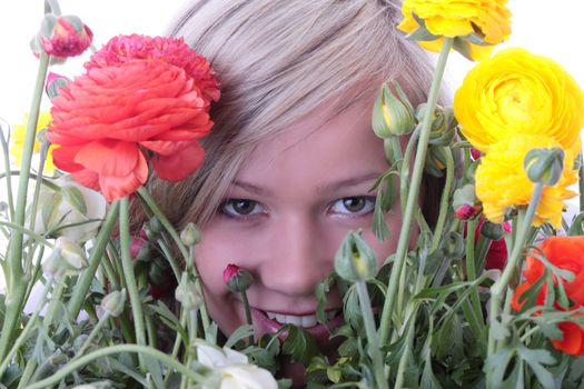Blond woman hiding behind colorfoul flowers isolated on white background