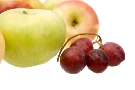 Apples and grapes close up on a white background