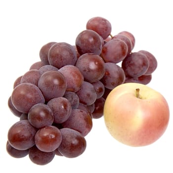 Apple and dark grapes on a white background