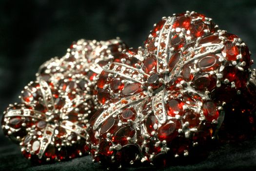 Pomegranates in silver on a black velvet
