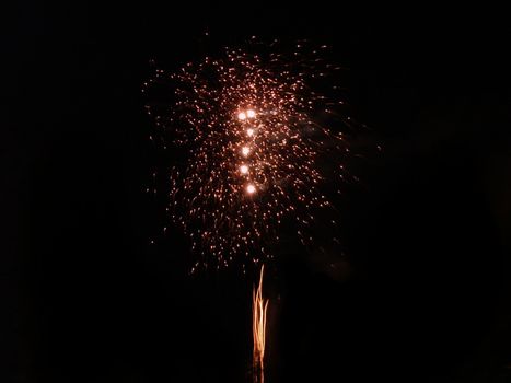 multicolored fireworks isolated on a black sky (fifth)