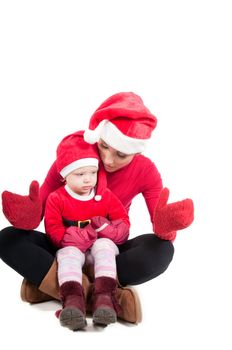 Santa mother and daughter in studio isolated