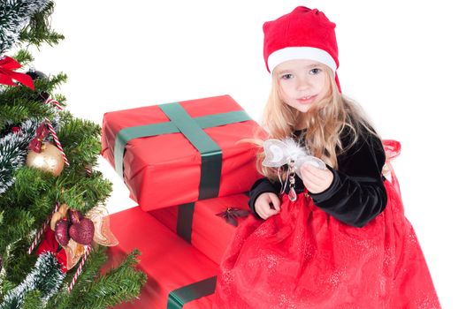 Beautiful baby girl dressed up for Christmas isolated in white