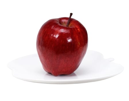 red apple on a apple shaped dish isolated over white