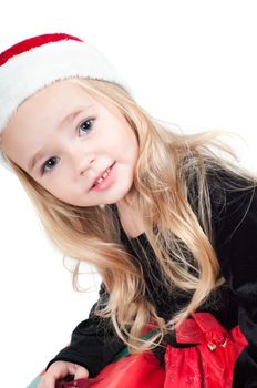 Beautiful baby girl dressed up for Christmas isolated in white