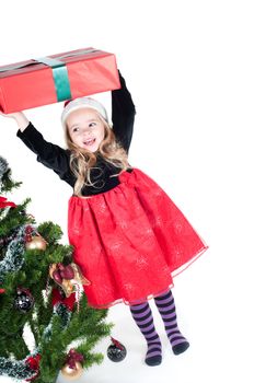 Beautiful baby girl dressed up for Christmas isolated in white