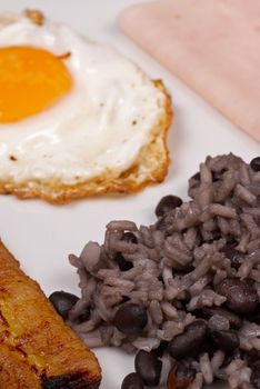 Hearty central american breakfast, gallo pinto with ham and egg