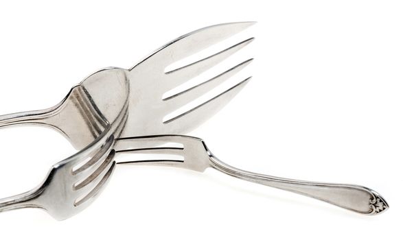 Silver forks set setout on a white background. With clipping path.