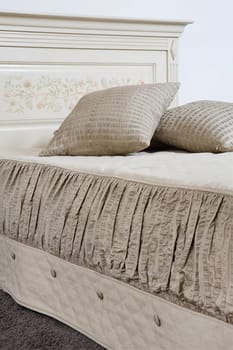 Decorative pillow on a bed in a bedroom