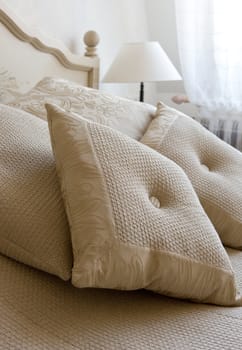 Decorative pillow on a bed in a bedroom