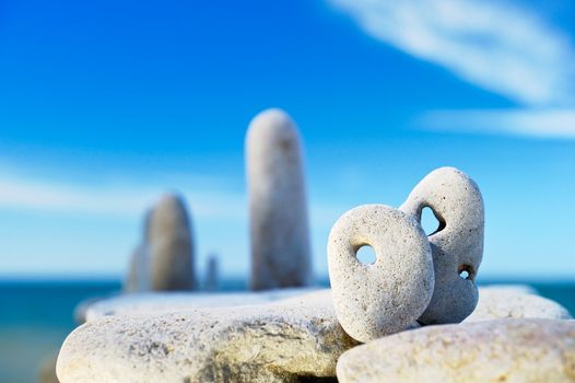 Stones with the holes located on the sea cliff