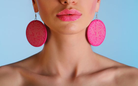 beautiful girl - close up of lips on blue background with work path over lips