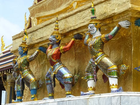 Statue of demon guardians at the Buddhist temple of Wat Phra Kaeo at the Grand Palance in Bangkok, Thailand.