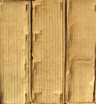 Brown grunge corrugated cardboard sheet useful as a background