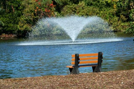 Park bench overlooking a fountain 