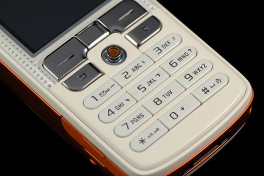 Close up of modern mobile phone over black