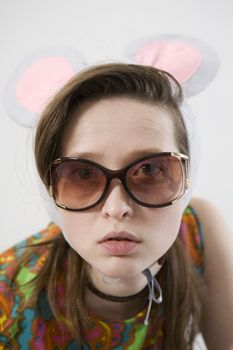 portrait young attractive woman wearing funny  mouse cap 