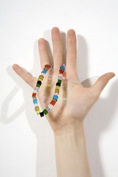 well shaped women hand with glass beads
