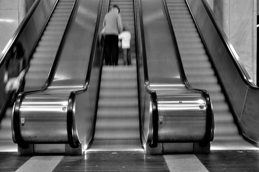 Blured three moving staircases in action