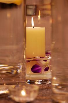 The close up shot of spa candles and flowers