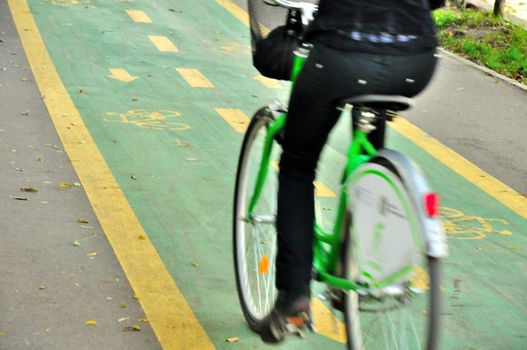 Woman biker on the bicycle track