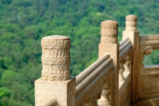 The close up view of stone carved handrail at Chinese pagoda