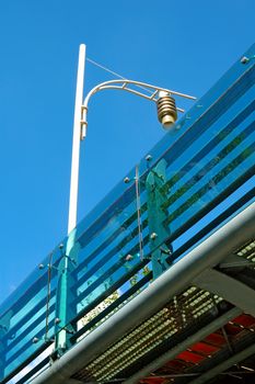 The partial of over bridge and a lamp post from bottom