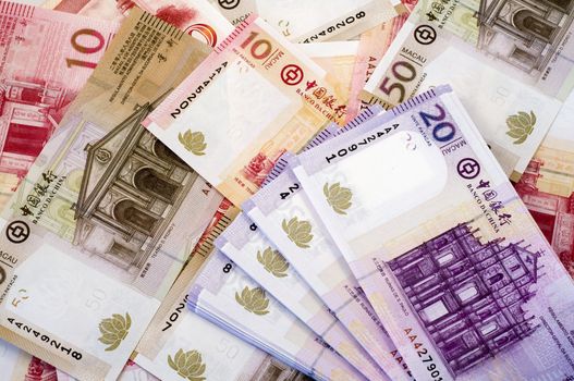 The stack of Macau Patacas (notes) and background 