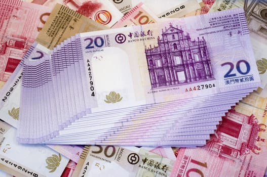 The stack of Macau Patacas (notes) and background 