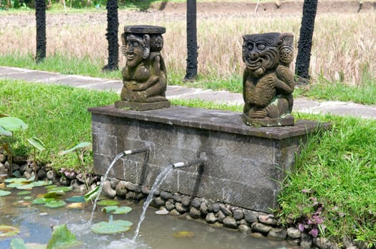 Unique fountain with balinese stone sculpture