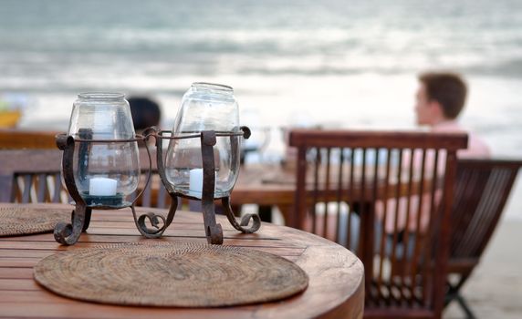 Table set of open-air restaurant, on beach