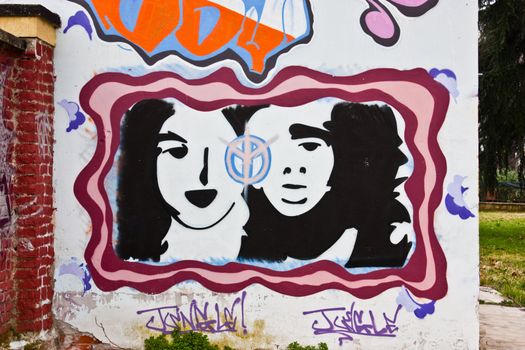 Wall with graffiti, urban scene, Torino, Italy