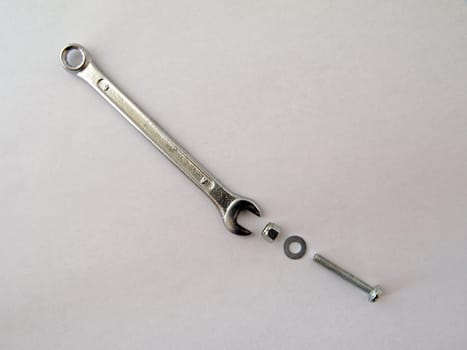 Spanner with a nut, bolt and washer.