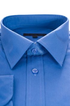 Closeup view of a blue formal shirt, isolated against a white background
