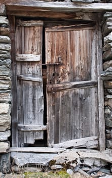 Old door made of wood, in Parco del Gran Paradiso, Italy