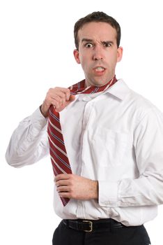 A stressed businessman is pulling on his tie and getting mad, isolated against a white background